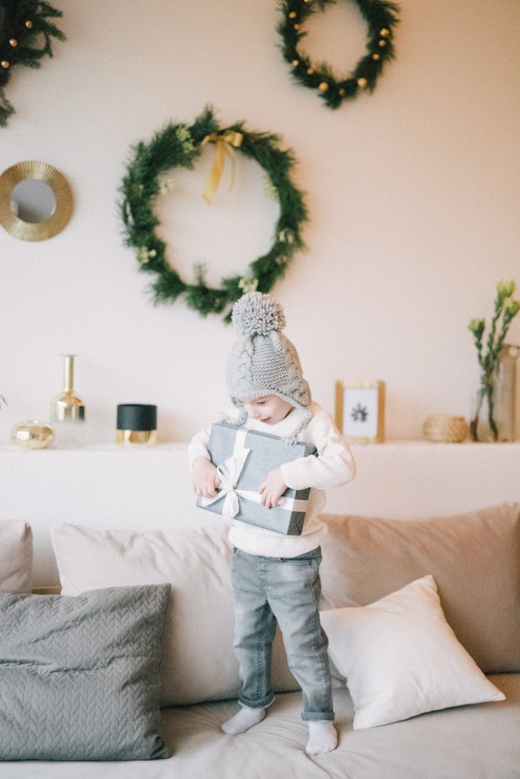 Kid Holding A Gift