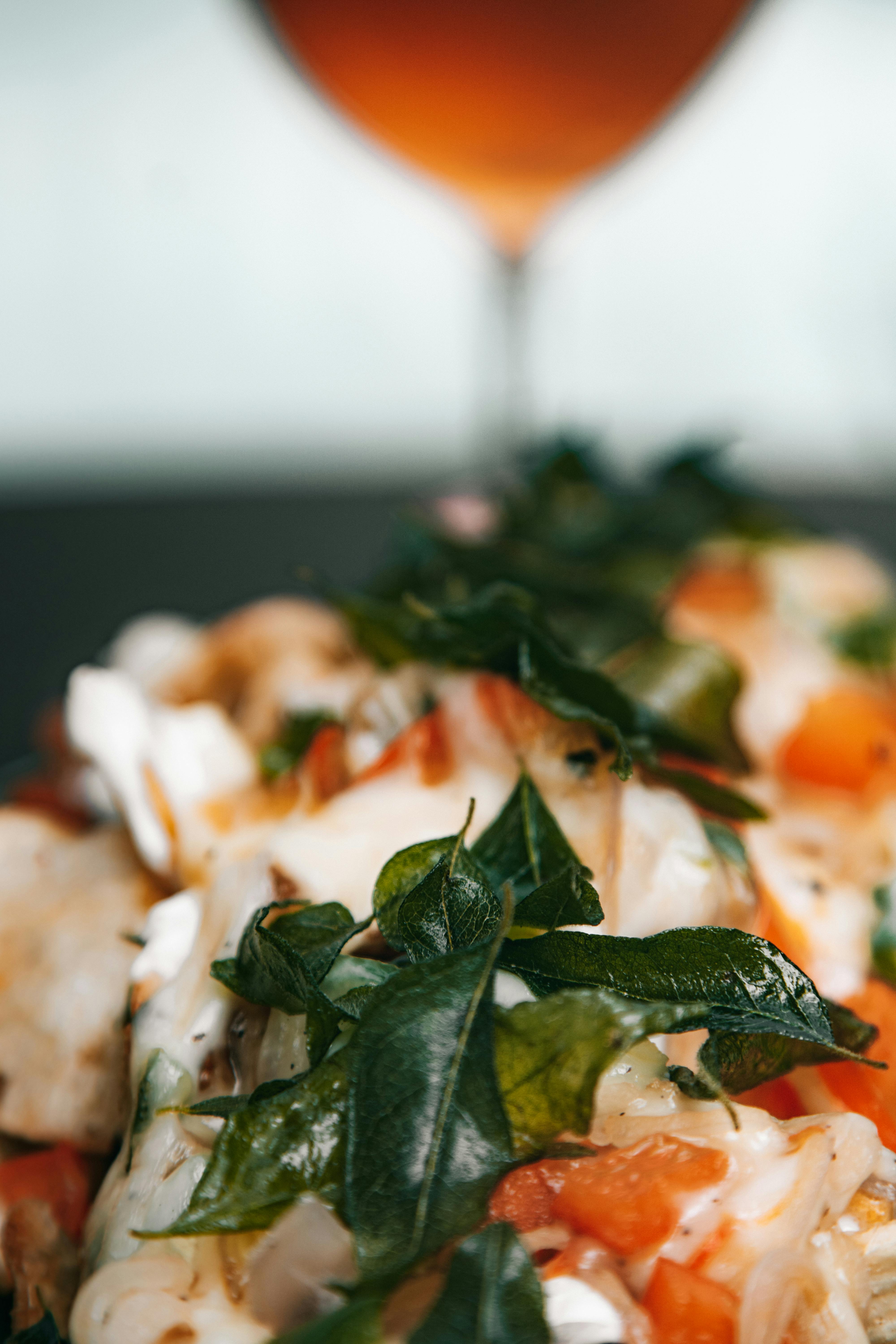 A close-up shot of a chef meticulously plating a dish with fresh, high-quality ingredients.