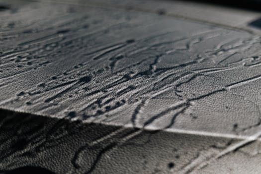 Extreme close-up of textured leather with shadows and intricate patterns.