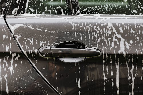 Free Black Car with Soap Bubbles Stock Photo