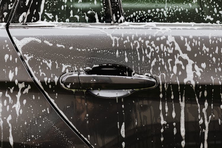 Black Car With Soap Bubbles