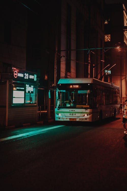 Free Photograph of a White Bus on the Road During the Night Stock Photo