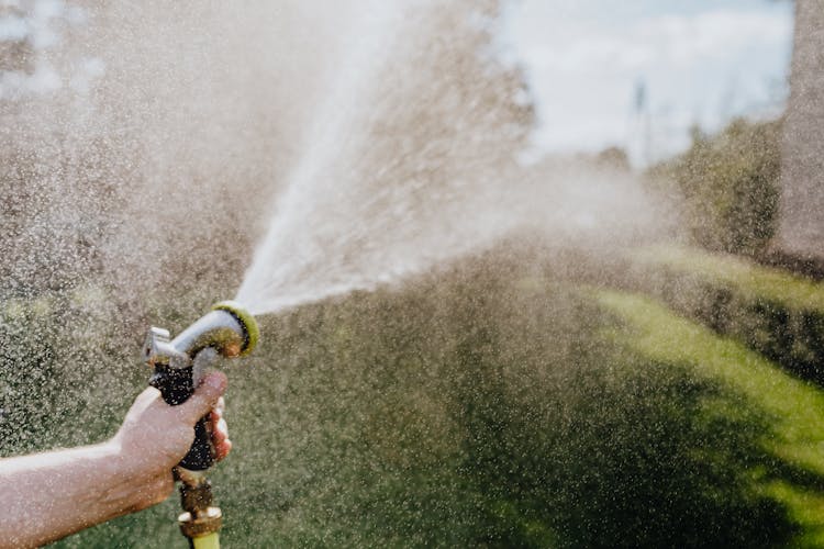 Close-Up Photo Of Water Coming Out Of A Spray Hose