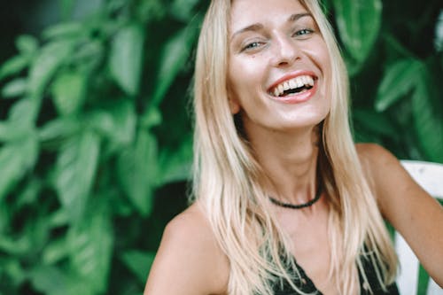Photo of a Woman with Blond Hair Smiling