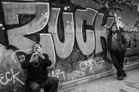 Man playing on trumpet on street