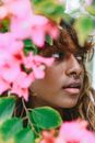 Portrait of Woman Behind Branch in Blossom 