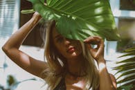 Woman Holding Huge Leaf 