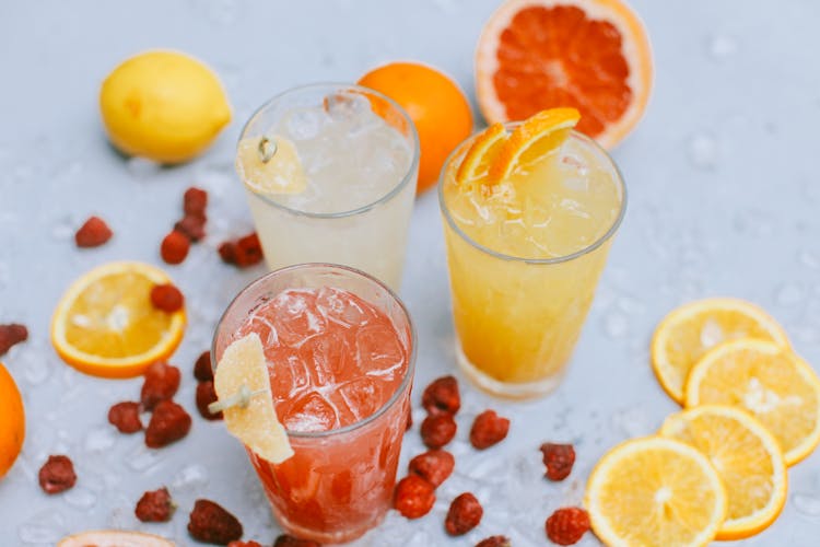 Sliced Fruits And Glasses Of Fruit Juice