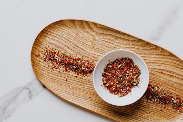 Herbs And Spices In White Ceramic Plate