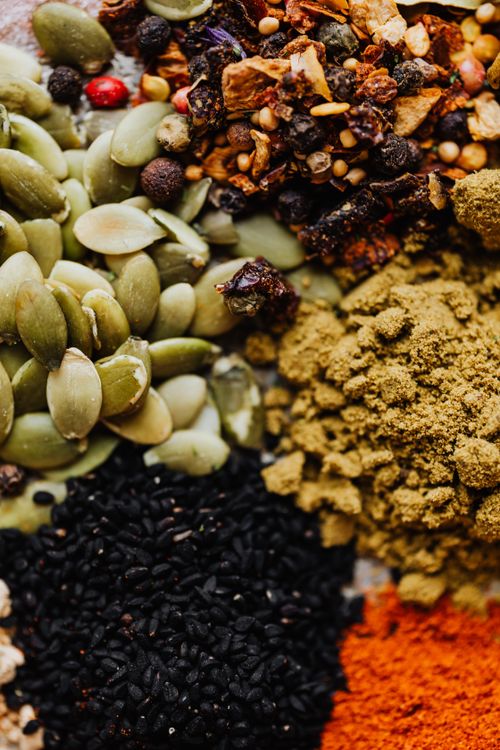 Free A vibrant mix of organic seeds and spices in a close-up shot, ideal for culinary themes. Stock Photo