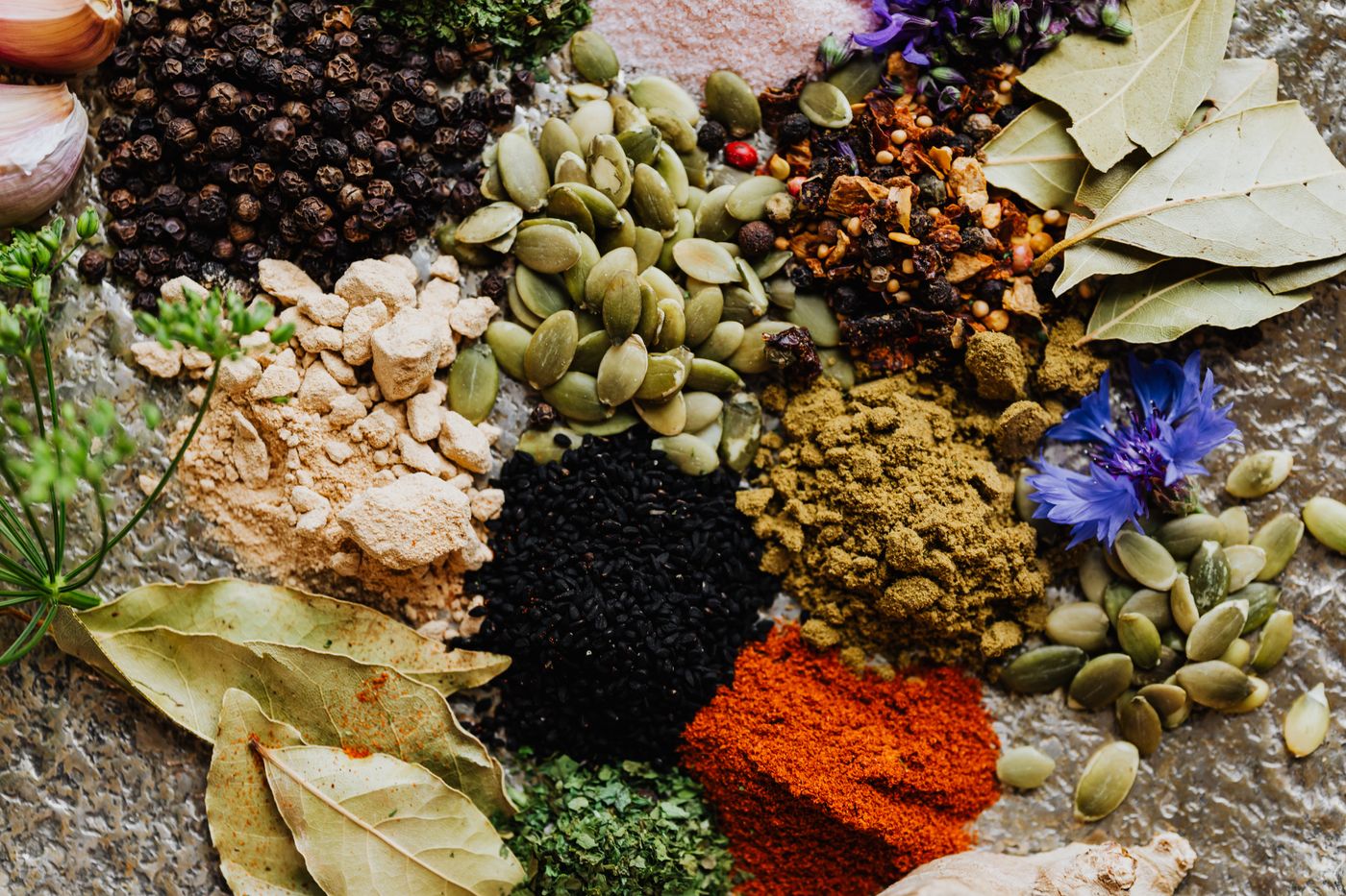Assorted herbs, seeds and spices illustrating agricultural ingredient variation