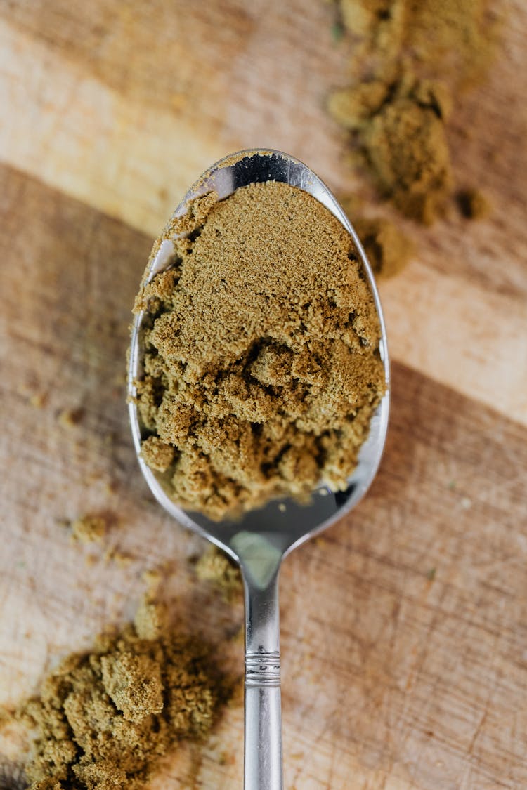 Brown Powder On Stainless Steel Spoon