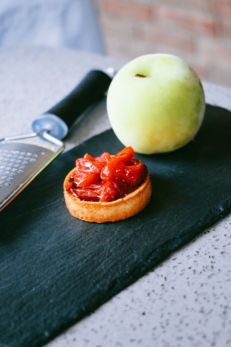 Strawberry Pastry And Apple On Counter