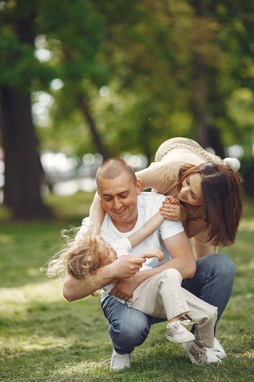 A Family Playing on the Grass