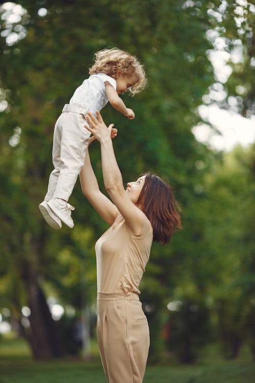 Free Close-Up Shot of a Mother and her Child Playing Stock Photo