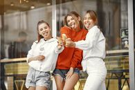 Teenage Girls Posing with Ice Creams with Tongues Out
