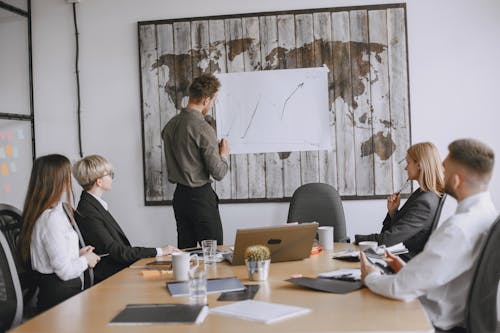 Businessman Making Presentation in Conference Room