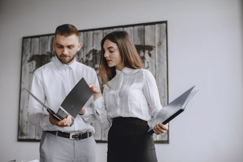 Coworkers Looking at Documents at the Office