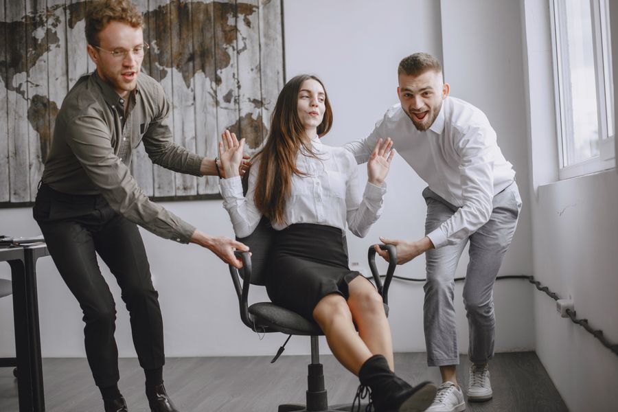 Young professionals enjoy playful moments in a contemporary office environment.