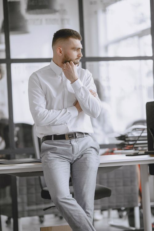 Portrait of Man Standing in Office · Free Stock Photo