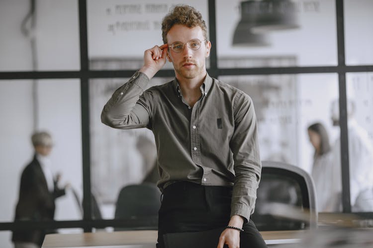 Office Portrait Of Employee In Glasses