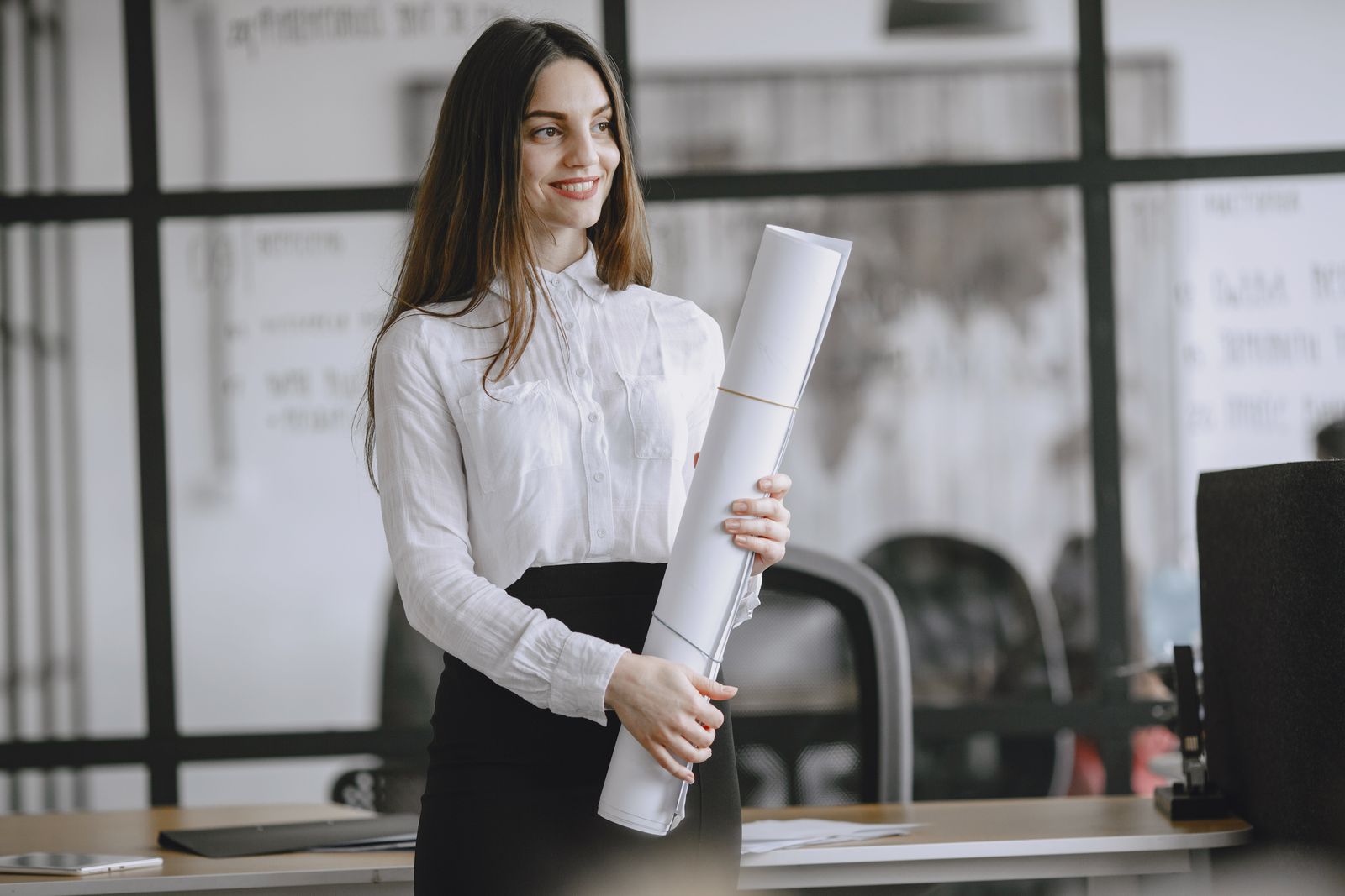Maya Ellis with a warm, confident smile in her office