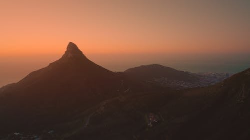 Silhouette Of Mountain During Sunset