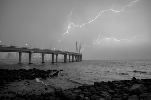 Free Dramatic lightning over Mumbai's iconic Bandra-Worli Sea Link at night. Stock Photo