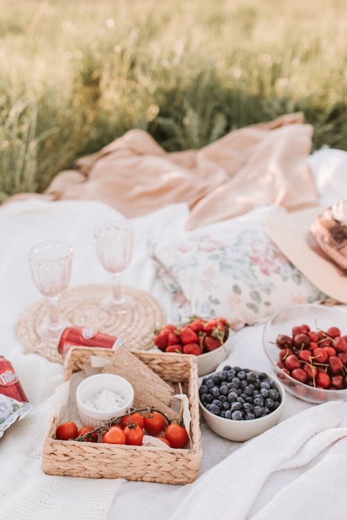 Red and Black Berries on Brown Woven Basket