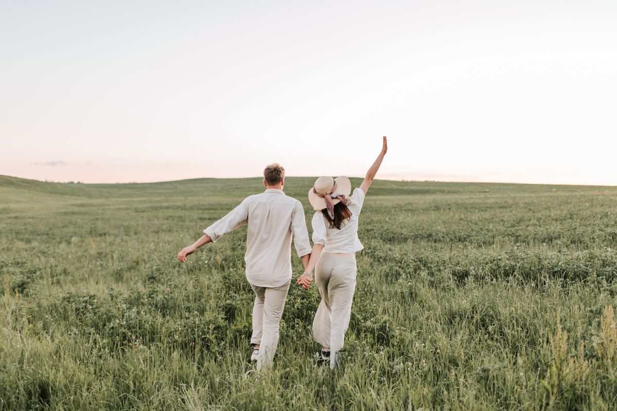 Couple walking together outdoors in supportive companionship