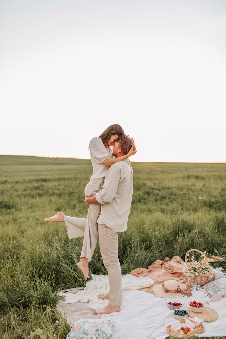 Photo Of Man Carrying Woman