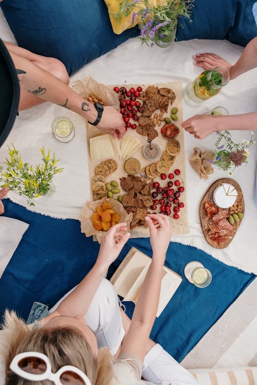 Free Person in White Shirt Holding White Ceramic Plate With Food Stock Photo