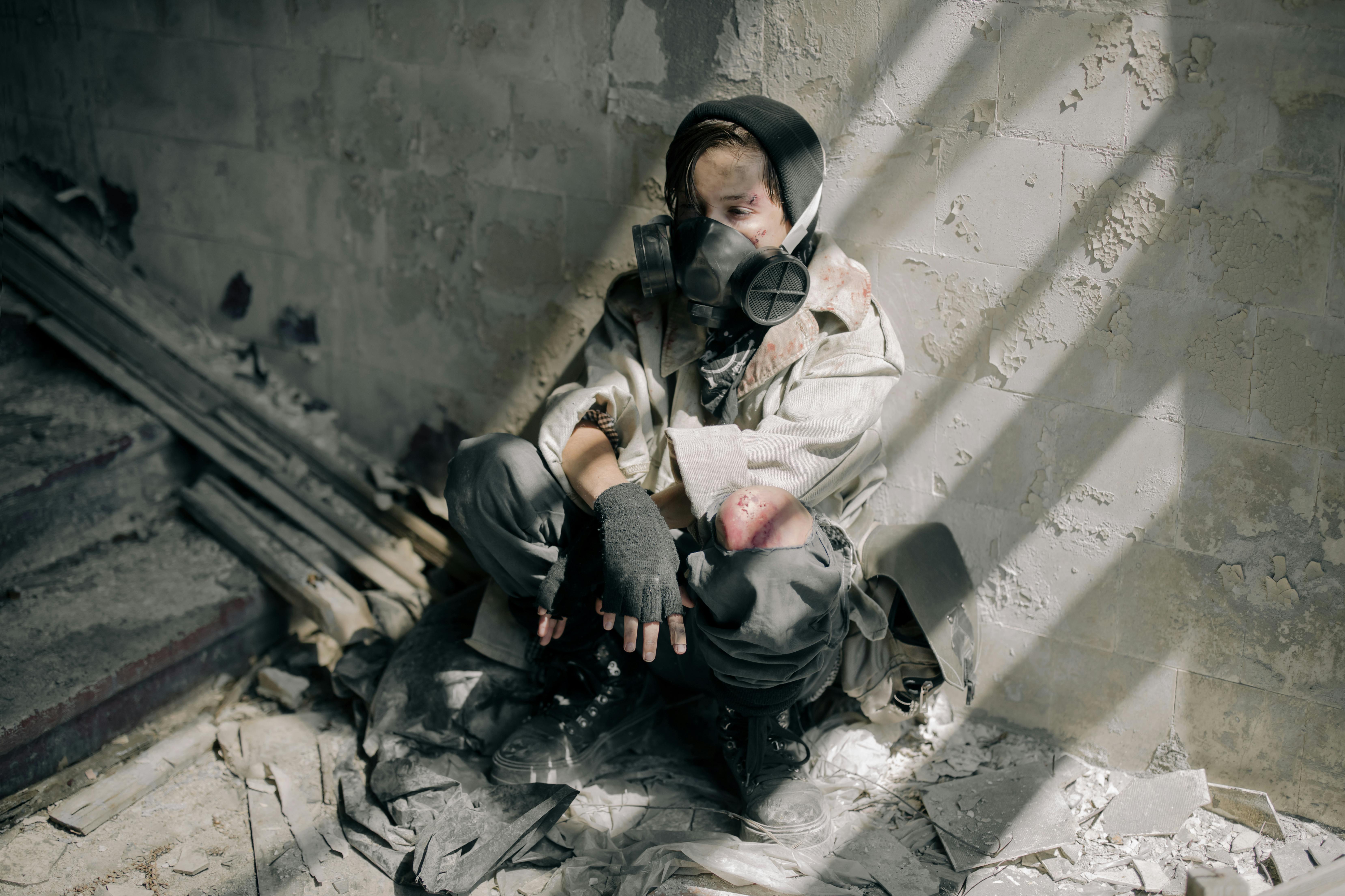 woman in black jacket sitting on floor