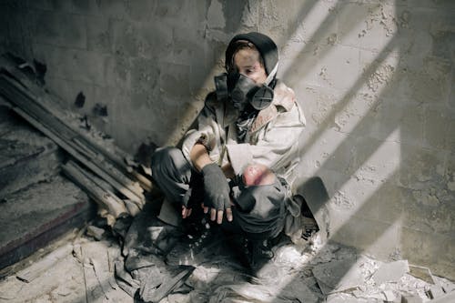 Woman in Black Jacket Sitting on Floor