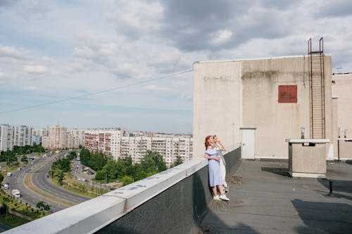 Woman in White Dress Standing on Gray Concrete Floor