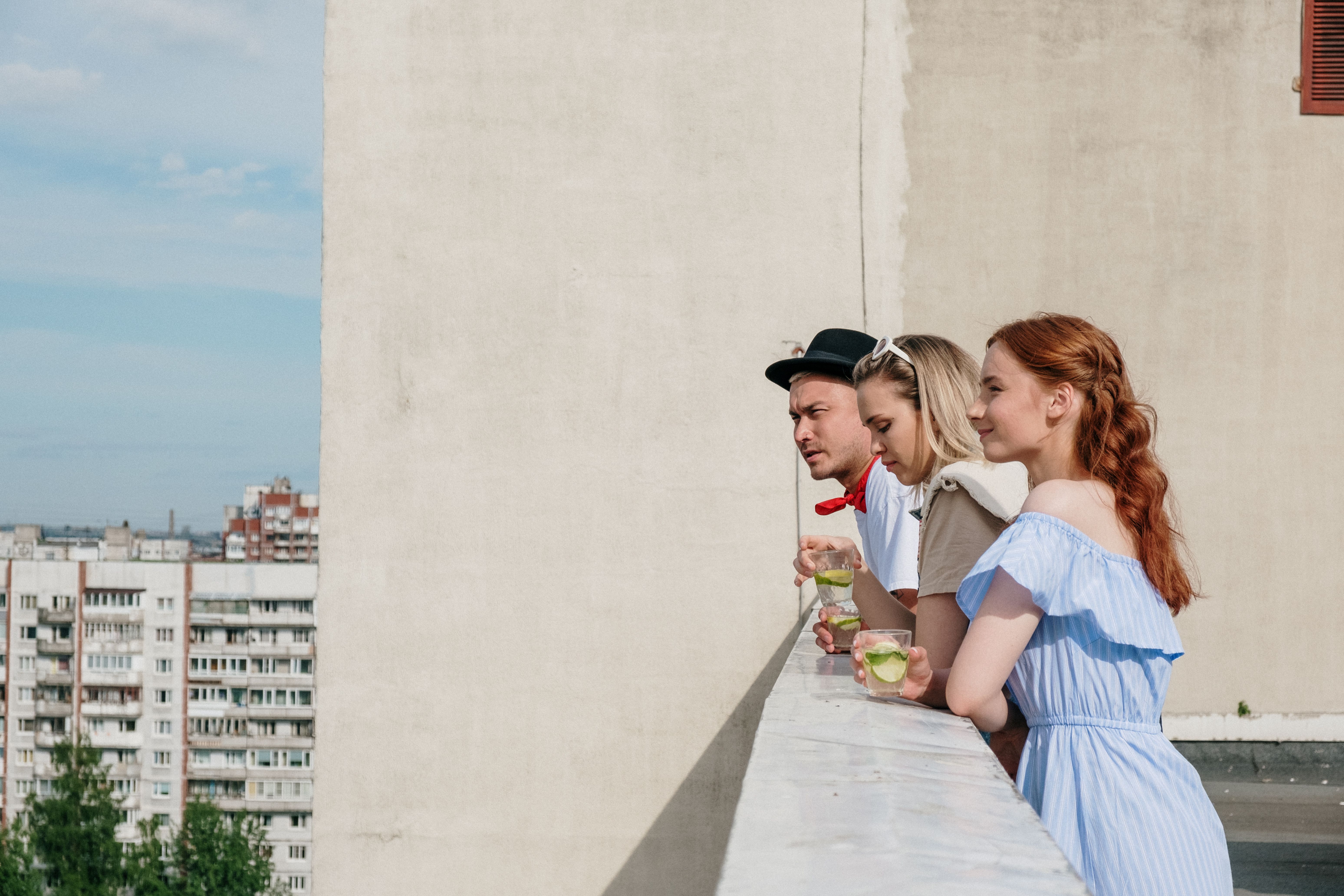 Woman in White Shirt Sitting on Concrete Stairs · Free Stock Photo