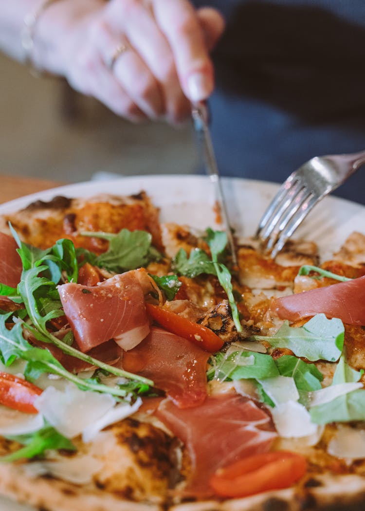 Person Having Delicious Salad With Salmon