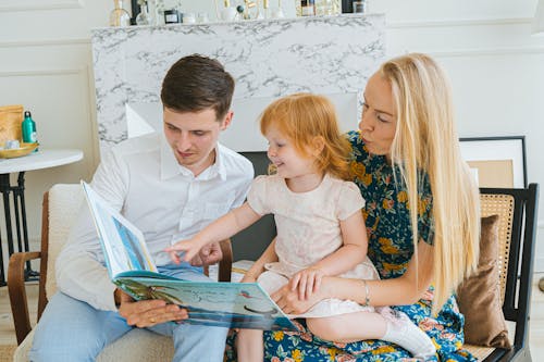 A Family Reading a Book Together