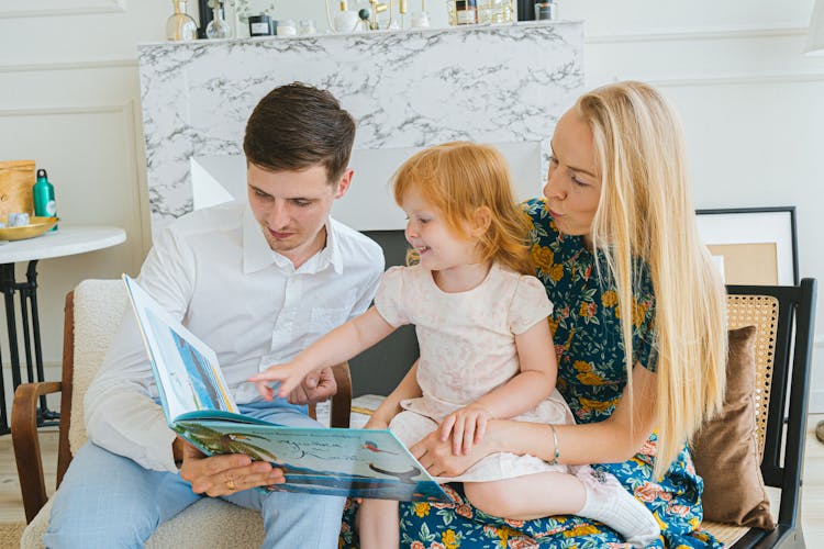 A Family Reading A Book Together