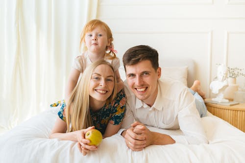 A Happy Family on a Bed