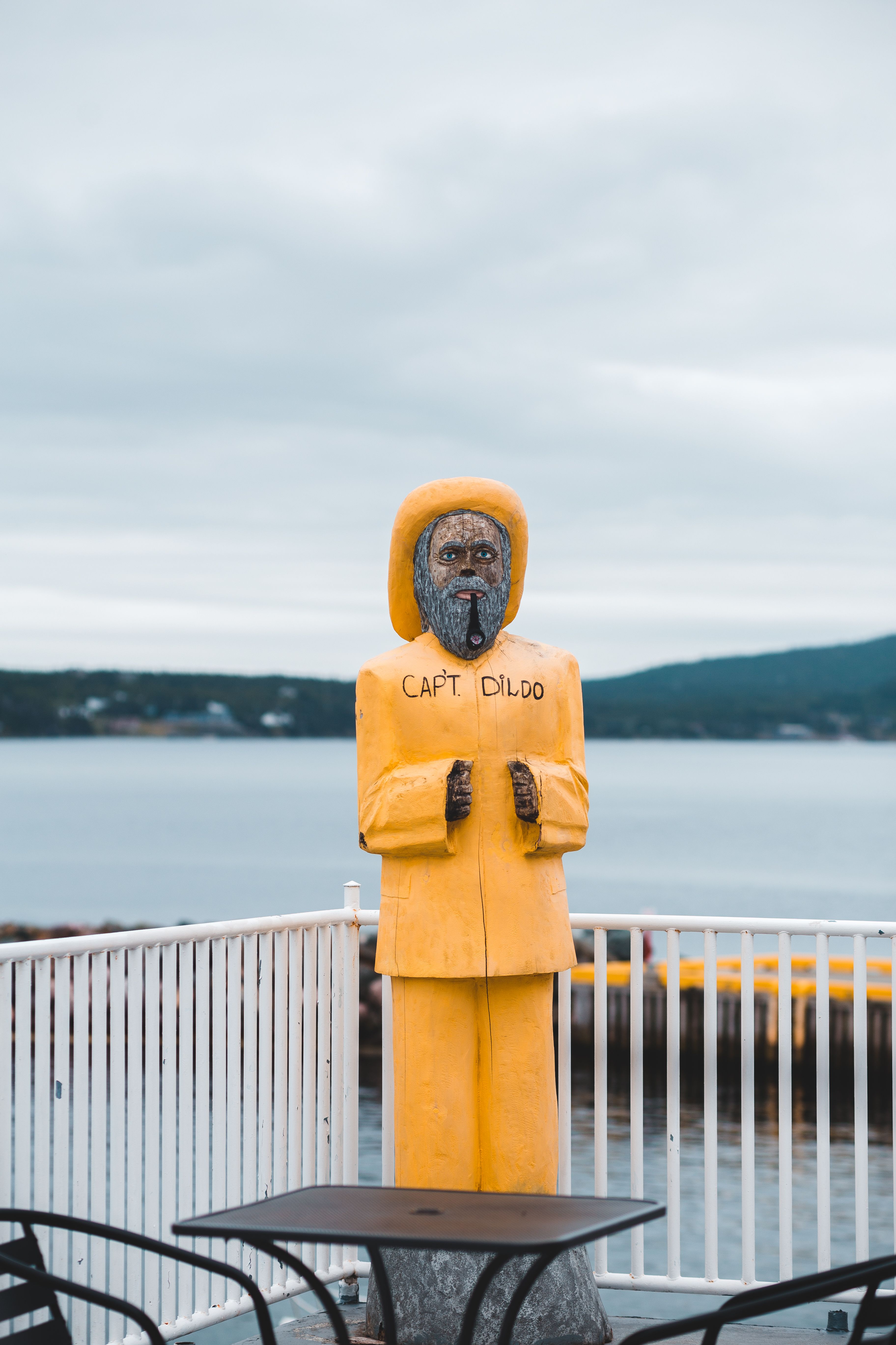 Figure of bearded man in yellow outfit · Free Stock Photo
