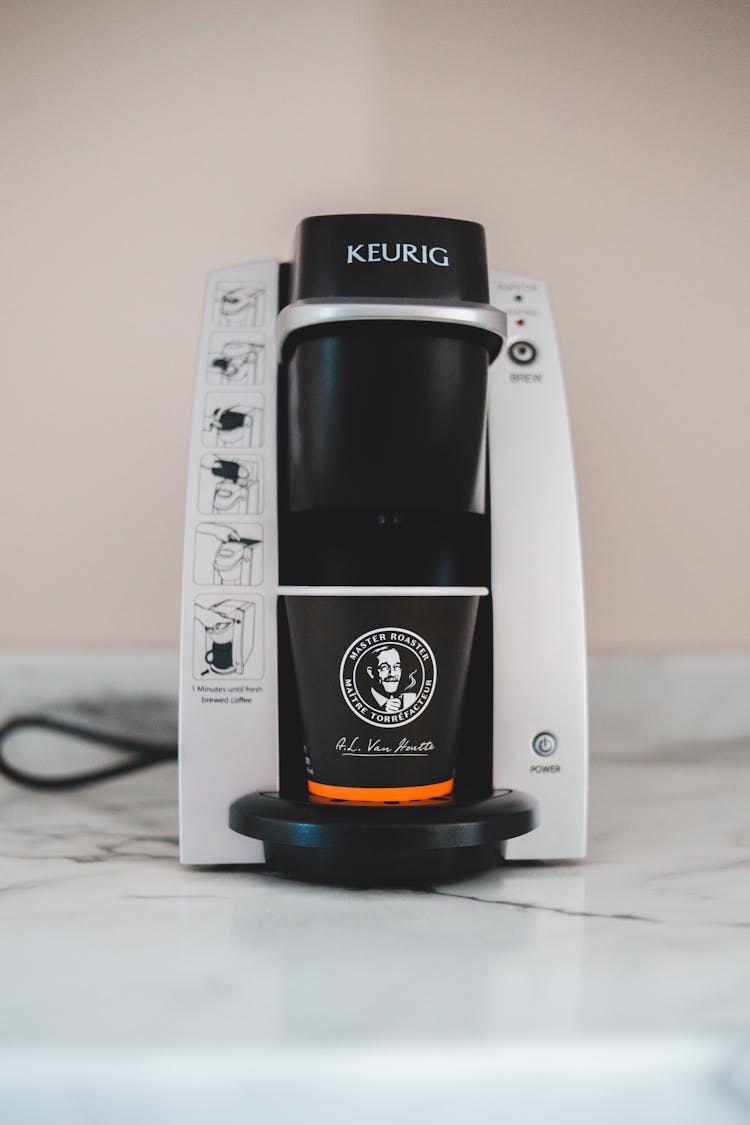 Modern Coffee Machine On Marble Table