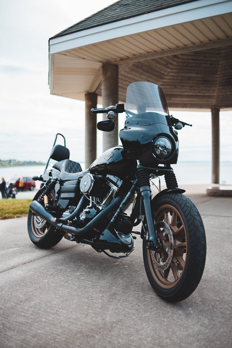 Classical Black Motorbike On Pavement By Rotunda