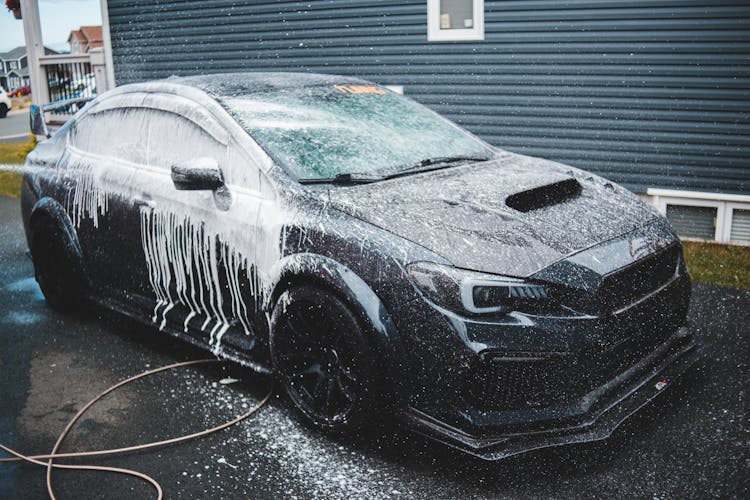 Luxury Car Under Foam At Car Wash