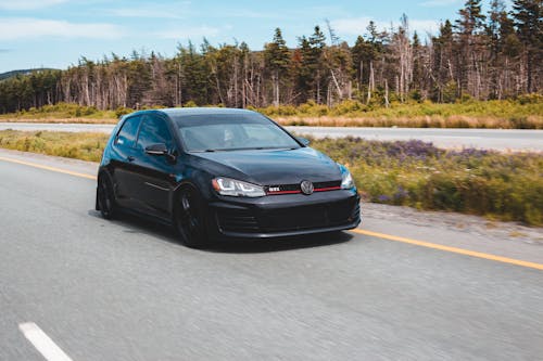 Black sports car on highway