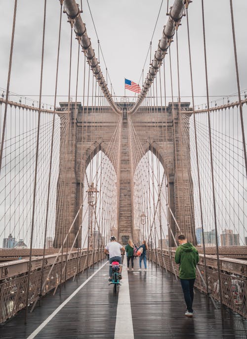 People Walking on the Bridge