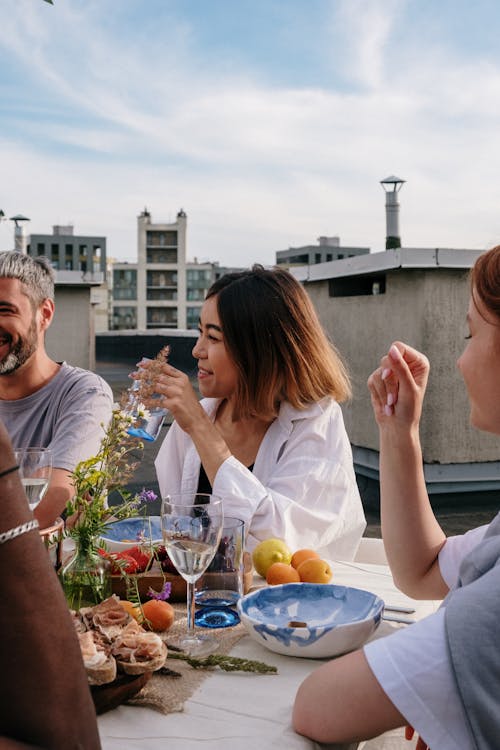 Man and Woman Sitting on Chair While Eating