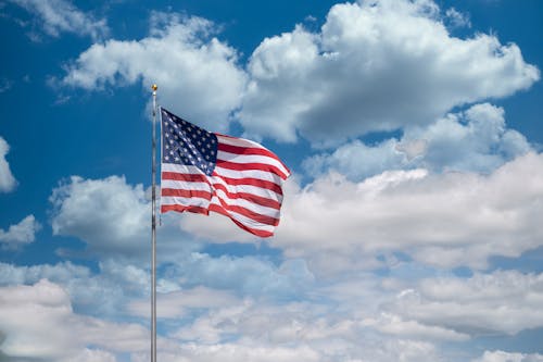 American Flag Under Blue Sky And White Clouds
