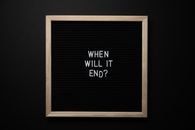 Top view of blackboard in wooden frame with title about fight for equality and justice