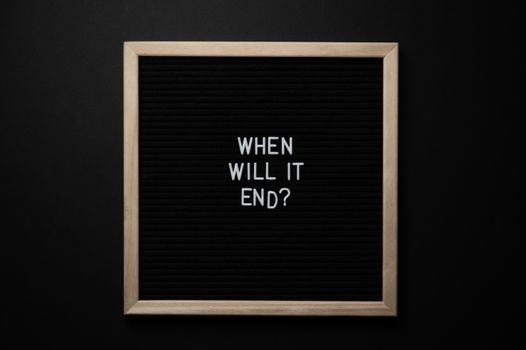 Top view of blackboard in wooden frame with title about fight for equality and justice